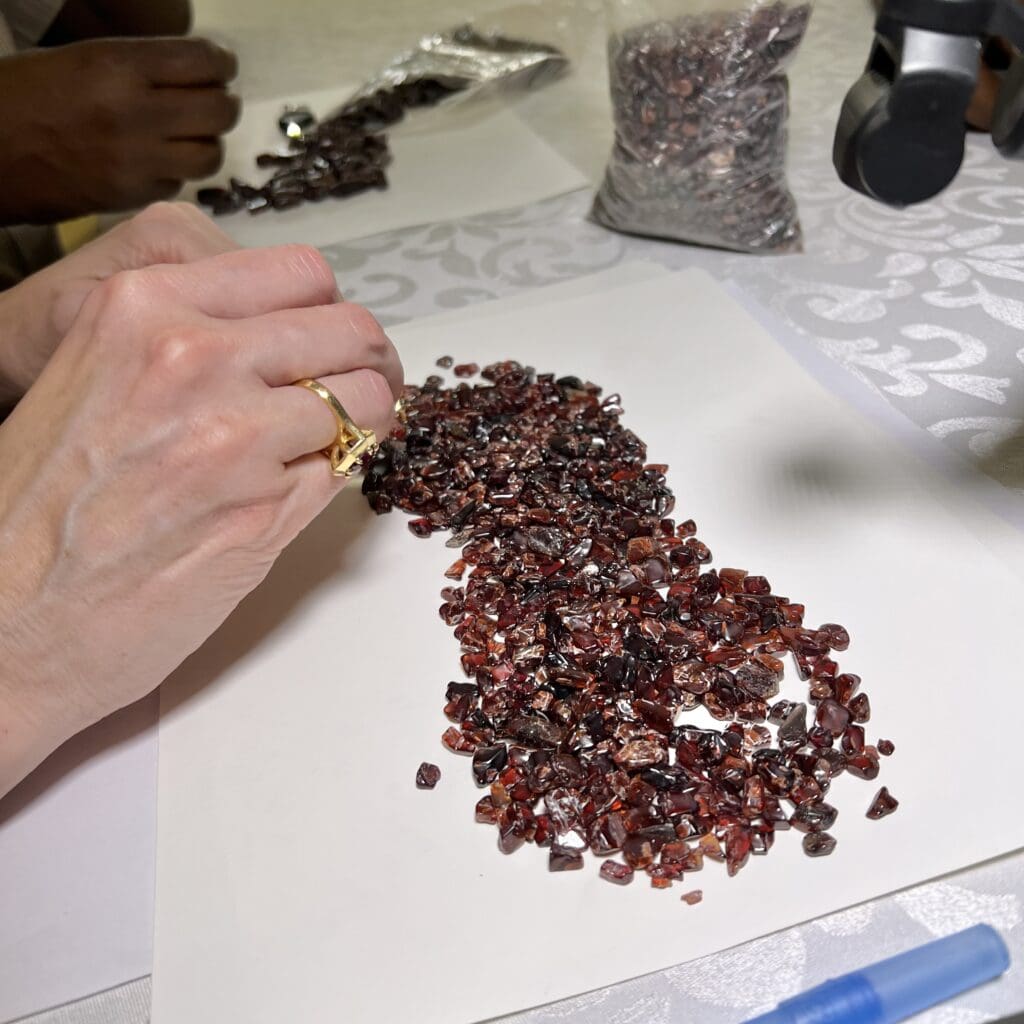 Garnet rough being weighed and assessed at a Tanzania Moyo Market Day. Photos by Chloe Beaumont.