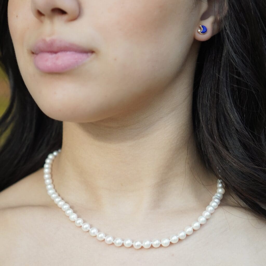 The Akoya Pearl Necklace by Mazahri paired with the Moon Studs in Lapis Lazuli by Mercurius. Photo by Morgan Burger.