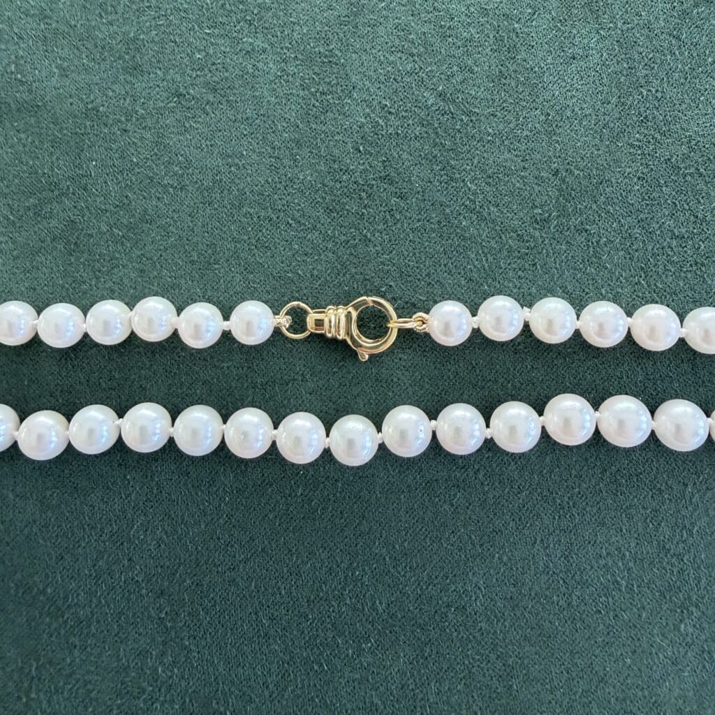 The Akoya Pearl necklace showing the yellow gold lobster style clasp. Photo by Chloe Beaumont