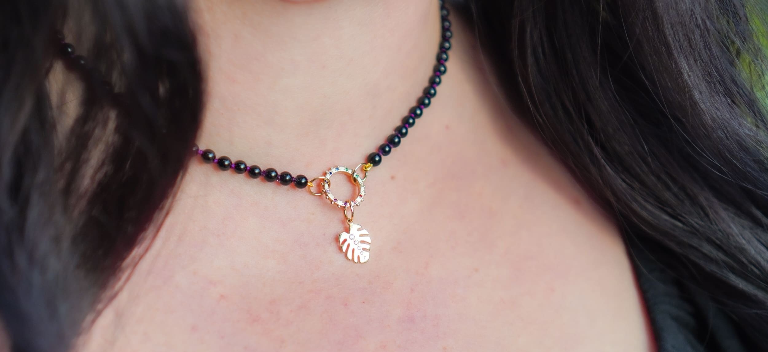 a monstera diamond charm by Delphine Leymarie